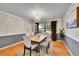 Dining room with wood floors, chandelier, and large window at 11326 E Berry Dr, Englewood, CO 80111