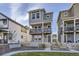 Two-story townhome with a gray exterior, white trim, and a small yard at 128 E Douglas St, Superior, CO 80027