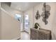 Entryway with storage cabinet and view to backyard at 128 E Douglas St, Superior, CO 80027
