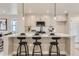 Modern kitchen with an island, stainless steel appliances, and white quartz countertops at 128 E Douglas St, Superior, CO 80027