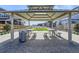 Covered picnic pavilion with tables and benches in a park setting at 128 E Douglas St, Superior, CO 80027