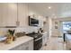 Modern kitchen with stainless steel appliances and ample cabinet space at 128 E Douglas St, Superior, CO 80027
