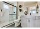 Modern bathroom with a large walk-in shower and gray tile floors at 128 E Douglas St, Superior, CO 80027
