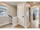 Light and bright hallway with hardwood floors and neutral walls at 128 E Douglas St, Superior, CO 80027