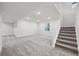 Finished basement with rec area and stairs at 5959 S Platte Canyon Dr, Littleton, CO 80123