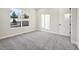 Bright bedroom with gray carpet and large window at 5959 S Platte Canyon Dr, Littleton, CO 80123