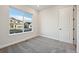Bright bedroom with carpeted floors and large window at 5959 S Platte Canyon Dr, Littleton, CO 80123