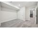 Spacious basement bedroom with carpet flooring and double doors at 5959 S Platte Canyon Dr, Littleton, CO 80123