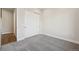 Bright bedroom with gray carpeting and double door closet at 5959 S Platte Canyon Dr, Littleton, CO 80123