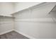 Spacious walk-in closet with ample shelving and hanging space at 5959 S Platte Canyon Dr, Littleton, CO 80123