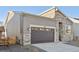 Modern home's exterior boasts stone accents and a two-car garage at 5959 S Platte Canyon Dr, Littleton, CO 80123