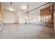 Spacious unfinished two-car garage with ample storage space at 5959 S Platte Canyon Dr, Littleton, CO 80123