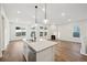 Open concept kitchen with island and hardwood floors at 5959 S Platte Canyon Dr, Littleton, CO 80123