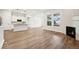 Bright living room features hardwood floors and a gas fireplace at 5959 S Platte Canyon Dr, Littleton, CO 80123
