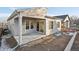 Covered patio with access to backyard; new construction at 5959 S Platte Canyon Dr, Littleton, CO 80123