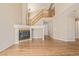 Bright and airy living room with hardwood floors and a corner fireplace at 22281 E Navarro Pl, Aurora, CO 80018