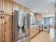 Kitchen boasts stainless steel appliances and light wood cabinets at 73 Blue Spruce Dr, Evergreen, CO 80439