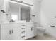 Modern bathroom with white cabinets and double vanity at 5663 W 142 Ave, Broomfield, CO 80020