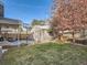 Large backyard with detached garage, basketball hoop, and trampoline at 1056 S Harrison St, Denver, CO 80209