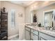 Elegant bathroom with double vanity and granite countertop at 1056 S Harrison St, Denver, CO 80209