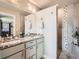 Modern bathroom with double vanity and walk-in shower at 1056 S Harrison St, Denver, CO 80209