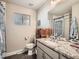 Clean bathroom with single vanity and shower/tub combo at 1056 S Harrison St, Denver, CO 80209