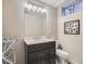 Basement bathroom with single vanity and toilet at 1056 S Harrison St, Denver, CO 80209
