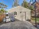 Detached garage with concrete parking area and grill at 1056 S Harrison St, Denver, CO 80209