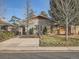 Charming ranch home with landscaped yard and driveway at 1056 S Harrison St, Denver, CO 80209