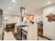Updated kitchen with granite countertops, stainless steel appliances, and an open layout at 1056 S Harrison St, Denver, CO 80209