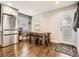Eat-in kitchen with stainless steel appliances and hardwood floors at 1056 S Harrison St, Denver, CO 80209
