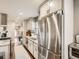 Modern kitchen boasting stainless steel appliances and ample cabinet space at 1056 S Harrison St, Denver, CO 80209