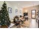 Bright living room with a Christmas tree, comfortable seating, and modern decor at 1056 S Harrison St, Denver, CO 80209