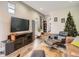 Open concept living area with large TV, comfortable seating, and a modern aesthetic at 1056 S Harrison St, Denver, CO 80209