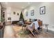 Spacious living room featuring a stylish leather couch and mid-century modern accents at 1056 S Harrison St, Denver, CO 80209