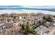 Aerial view of a townhome community by the lake; showing multiple buildings and parking at 4760 S Wadsworth Blvd # K103, Littleton, CO 80123