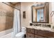 Bathroom with granite vanity and tub shower combo at 456 Crystal Ridge Rd, Evergreen, CO 80439