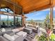 Covered deck offering mountain views and comfortable seating at 456 Crystal Ridge Rd, Evergreen, CO 80439