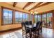 Bright dining room with a rustic table and chairs, offering scenic views at 456 Crystal Ridge Rd, Evergreen, CO 80439