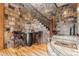 Stone staircase with a rustic wooden railing at 456 Crystal Ridge Rd, Evergreen, CO 80439