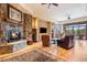 Spacious living room with stone fireplace and mountain views at 456 Crystal Ridge Rd, Evergreen, CO 80439