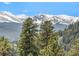 Breathtaking view of snow-covered mountain range under a clear blue sky at 456 Crystal Ridge Rd, Evergreen, CO 80439