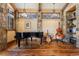 Rustic music room with piano, guitar, and bass at 456 Crystal Ridge Rd, Evergreen, CO 80439