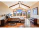 Large main bedroom with high ceilings, stunning views, and hardwood floors at 456 Crystal Ridge Rd, Evergreen, CO 80439