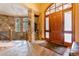 Elegant entryway with stone wall and wood door at 456 Crystal Ridge Rd, Evergreen, CO 80439