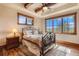 Bright bedroom with mountain views and wood floors at 456 Crystal Ridge Rd, Evergreen, CO 80439