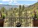 Stunning mountain views with snow-capped peaks and lush pine trees at 456 Crystal Ridge Rd, Evergreen, CO 80439