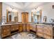 Double vanity bathroom with custom cabinetry and a large walk-in shower at 456 Crystal Ridge Rd, Evergreen, CO 80439