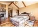 Spacious main bedroom with a fireplace and access to a private bathroom at 456 Crystal Ridge Rd, Evergreen, CO 80439