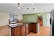 L-shaped kitchen island with granite countertops at 19536 E Iowa Cir, Aurora, CO 80017